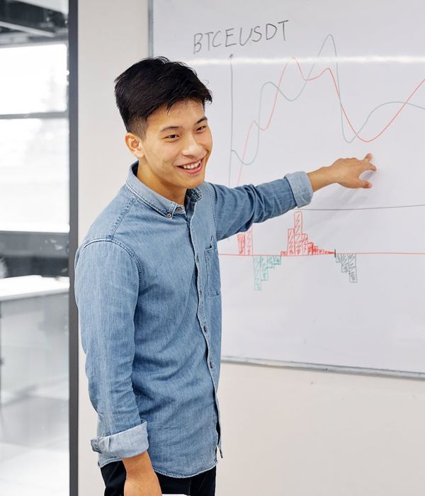 Beginner investor learning investment fundamentals with educational materials and charts