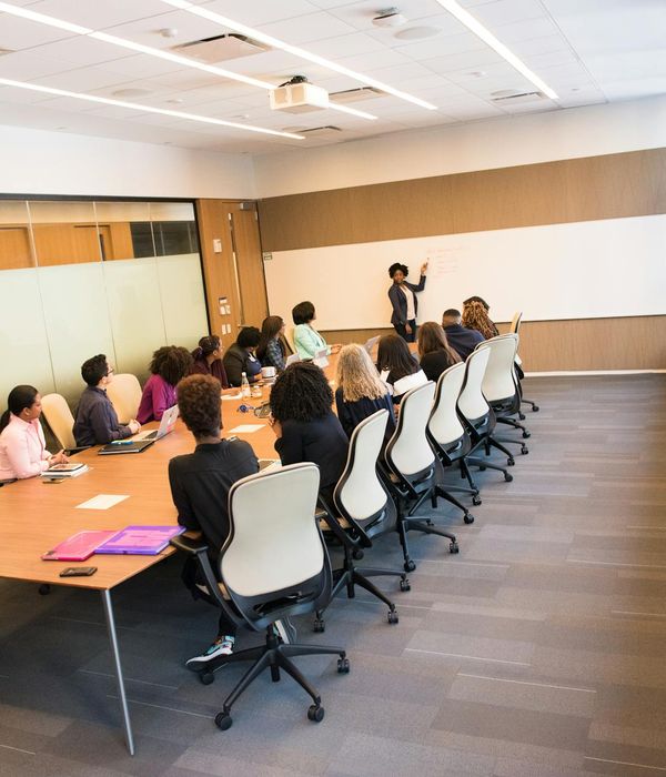 Corporate team analyzing investment portfolio during professional training workshop